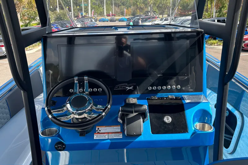  Yacht Photos Pics 2024 GSX 36 boat dashboard with steering wheel and digital displays.