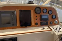 Dashboard of 1998 ACM Heritage 26 boat with navigation instruments.