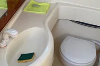 ACM Heritage 26 boat bathroom, 1998 model, featuring sink and toilet.