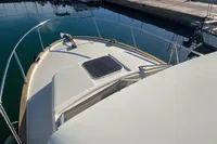 1998 ACM Heritage 26 boat deck with railing, docked in a marina.