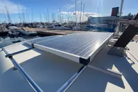 Solar panel on ACM Heritage 26 yacht, docked at marina, sunny day.