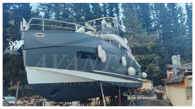  Yacht Photos Pics 2015 Azimut Magellano 53 yacht on dry dock with forest background.
