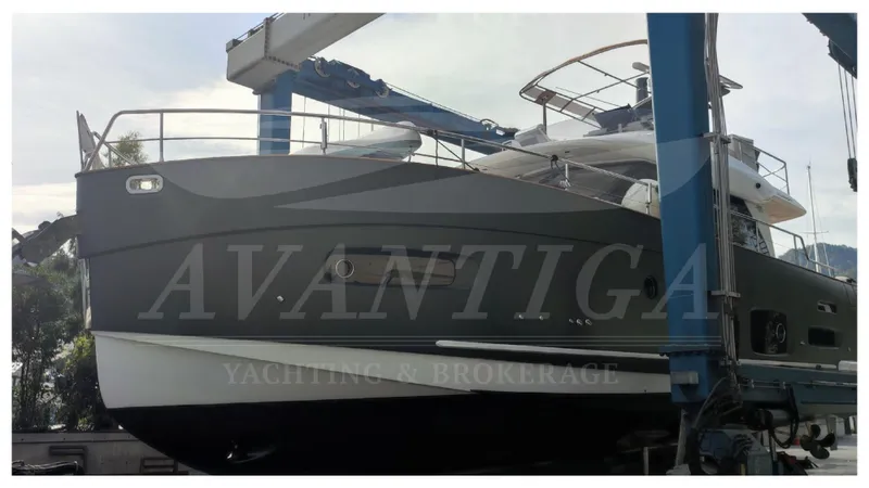  Yacht Photos Pics 2015 Azimut Magellano 53 yacht in dry dock, side view with lifting equipment.