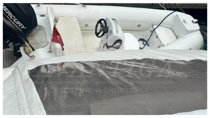  Yacht Photos Pics 2015 Azimut Magellano 53 yacht interior with steering wheel and seating area.
