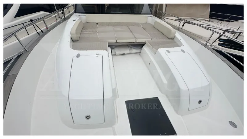  Yacht Photos Pics 2015 Azimut Magellano 53 yacht deck with cushioned seating area.
