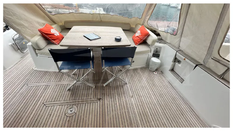  Yacht Photos Pics Azimut Magellano 53 yacht deck with table, chairs, and cushions, 2015 model.
