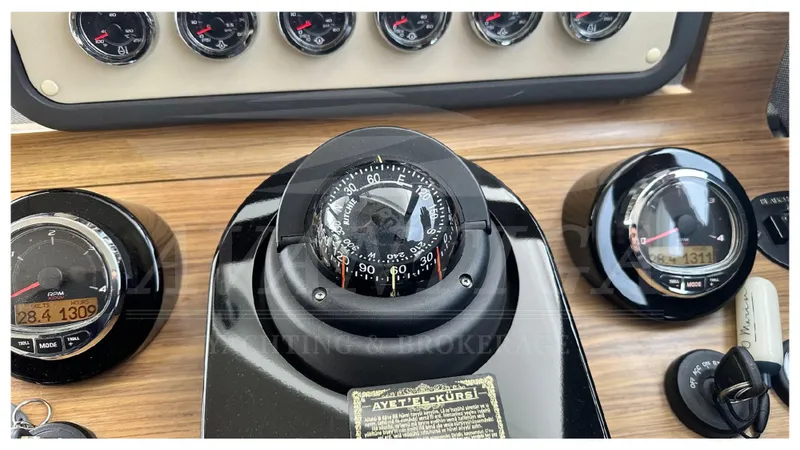  Yacht Photos Pics Control panel of 2015 Azimut Magellano 53 yacht with compass and gauges.