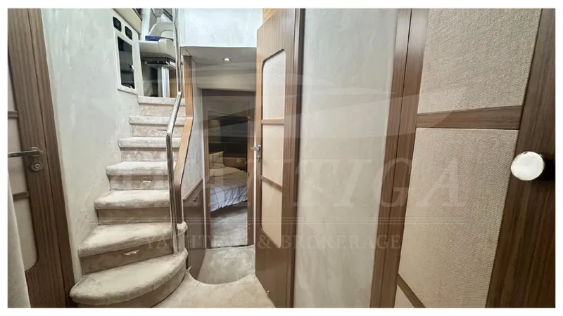  Yacht Photos Pics Interior view of 2015 Azimut Magellano 53 yacht with staircase and cabin.