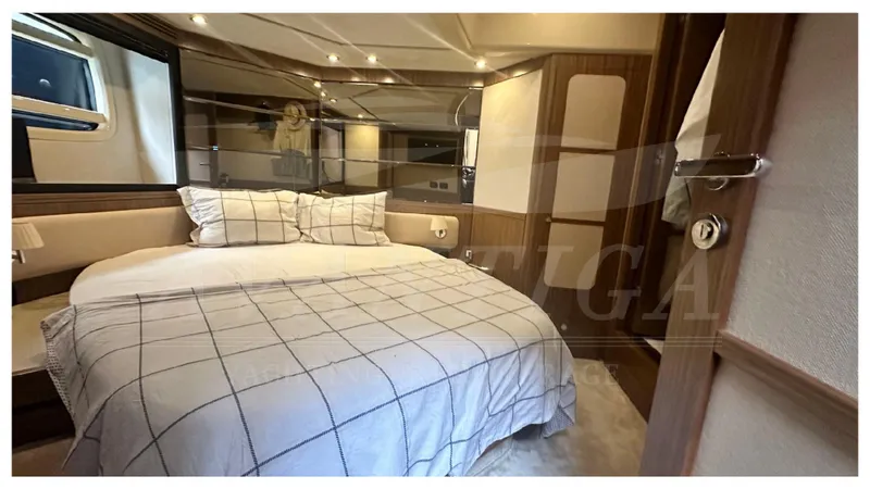  Yacht Photos Pics Luxurious bedroom interior of 2015 Azimut Magellano 53 yacht with elegant bedding.