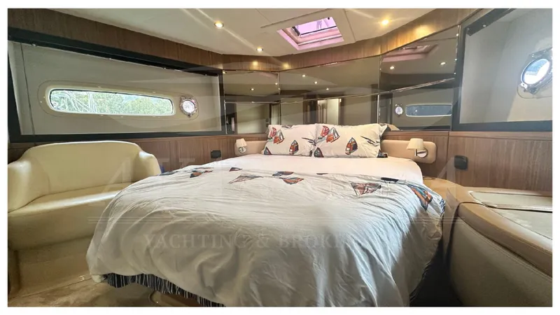  Yacht Photos Pics Luxurious bedroom interior of 2015 Azimut Magellano 53 yacht with elegant decor.