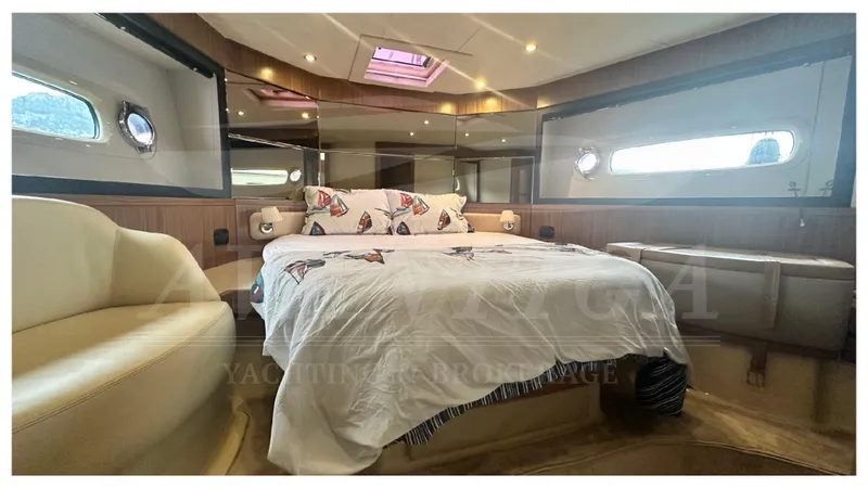  Yacht Photos Pics Luxurious bedroom interior of 2015 Azimut Magellano 53 yacht with elegant decor.
