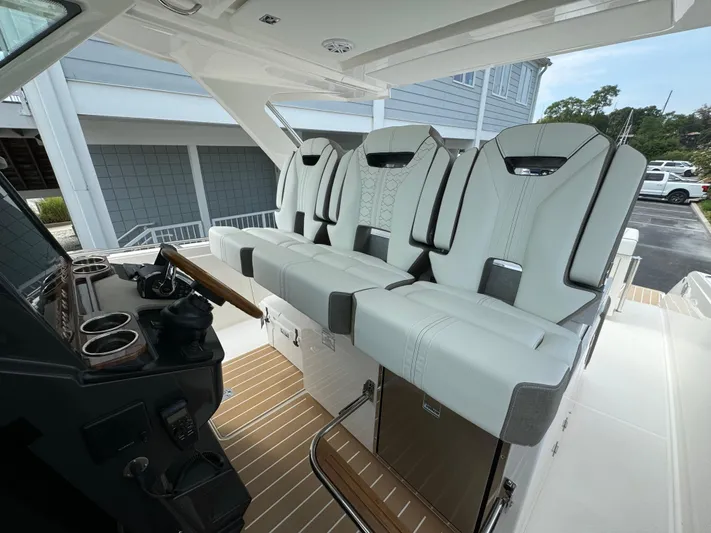  Yacht Photos Pics 2025 Tiara Yachts 34 LS interior with modern seating and sleek design.