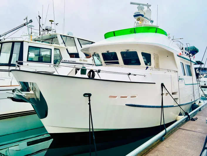 Journey Yacht Photos Pics White Bracewell Latitude 47 yacht docked, showcasing sleek design and modern features.