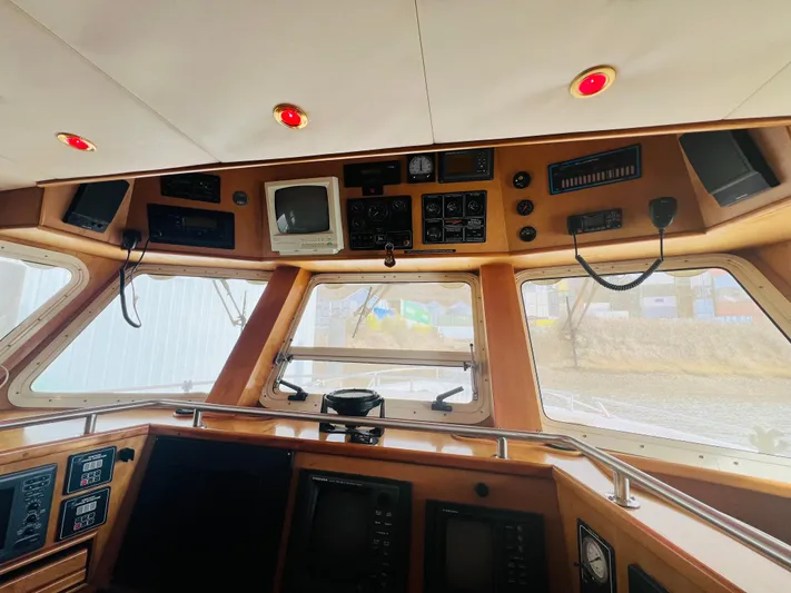 Journey Yacht Photos Pics Interior view of 2001 Bracewell Latitude 47 yacht cockpit with navigation equipment.