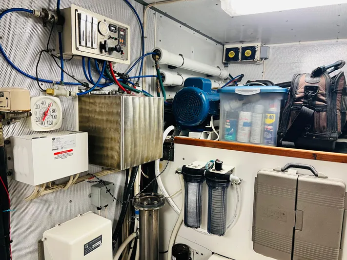 Journey Yacht Photos Pics Engine room of a 2001 Bracewell Latitude 47 yacht, featuring equipment and storage.