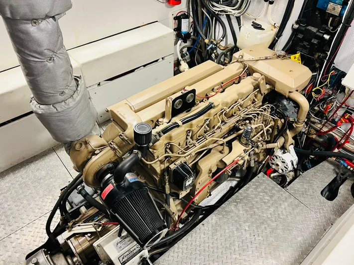 Journey Yacht Photos Pics Engine room of 2001 Bracewell Latitude 47 yacht, showcasing detailed mechanical components and wiring.