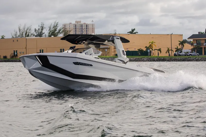 Yacht Photos Pics 2025 Nautique Super Air Nautique G25 Paragon cruising on water, showcasing sleek design.