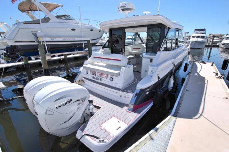 Elena Trinidad Yacht Photos Pics 2021 Regal 36 XO boat docked with Yamaha engines, showcasing sleek design and modern features.