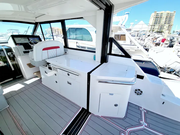 Elena Trinidad Yacht Photos Pics 2021 Regal 36 XO yacht interior with modern helm and sleek design at marina.