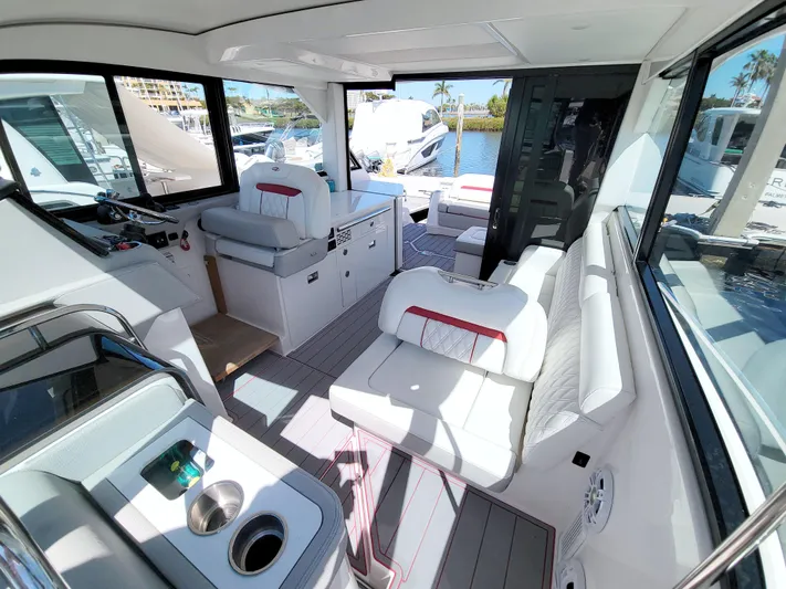 Elena Trinidad Yacht Photos Pics 2021 Regal 36 XO yacht interior with white seating and modern design.