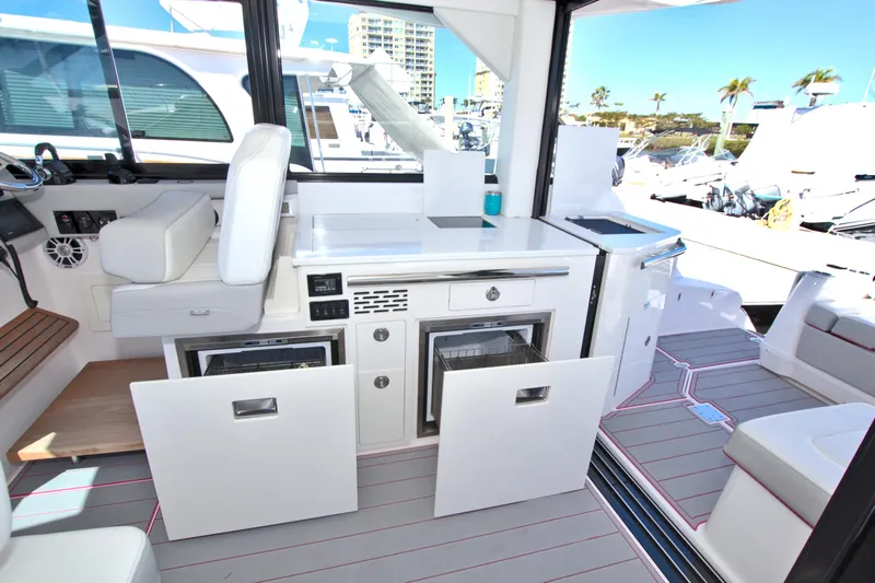 Elena Trinidad Yacht Photos Pics 2021 Regal 36 XO yacht interior with modern kitchen and seating area.