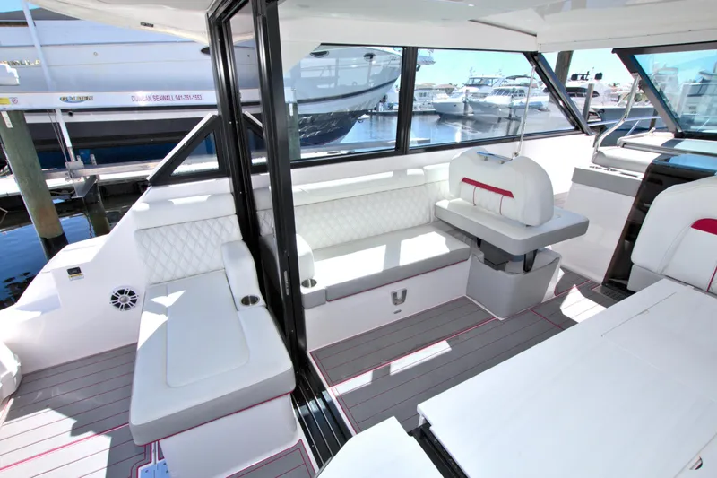 Elena Trinidad Yacht Photos Pics 2021 Regal 36 XO yacht interior with white seating and modern design.