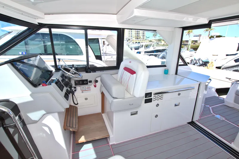 Elena Trinidad Yacht Photos Pics 2021 Regal 36 XO yacht interior with modern helm and seating area.
