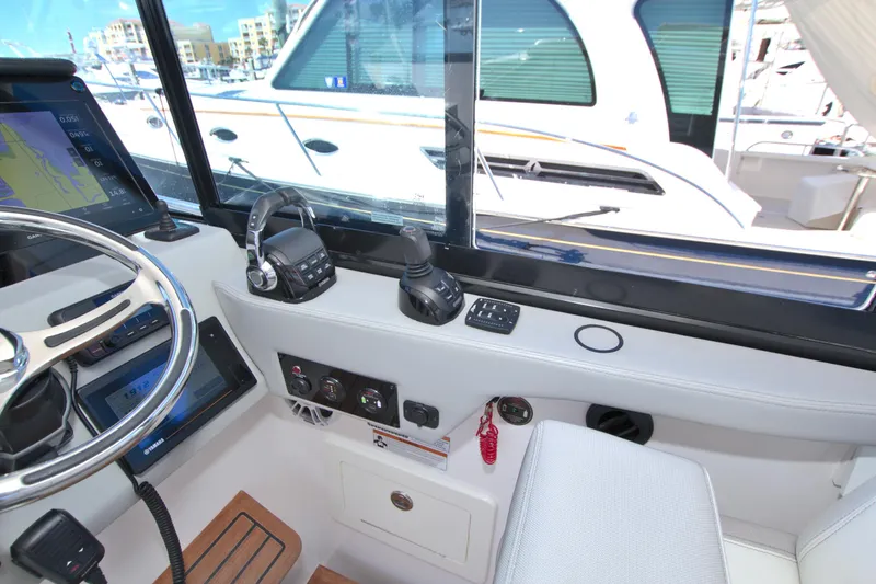 Elena Trinidad Yacht Photos Pics Helm of 2021 Regal 36 XO boat with modern controls and navigation equipment.