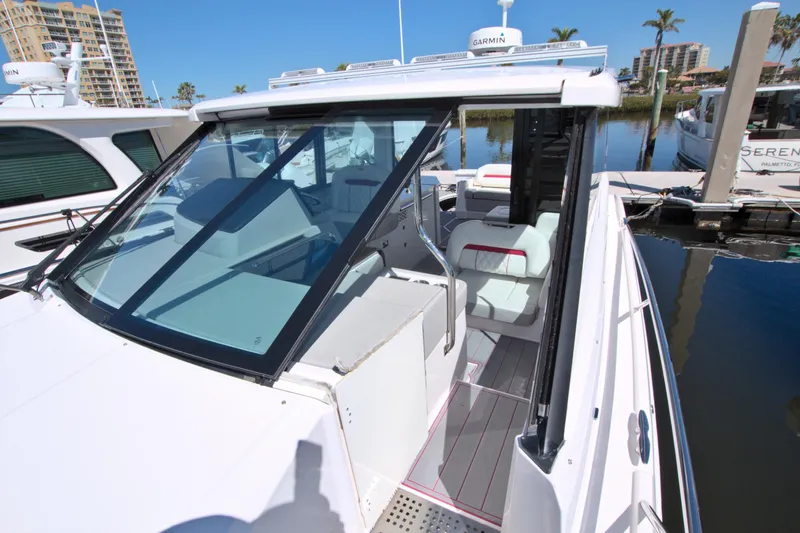 Elena Trinidad Yacht Photos Pics 2021 Regal 36 XO boat with sleek design docked at marina.