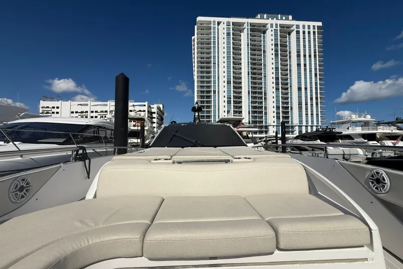 Chicken Money Yacht Photos Pics 2023 Azimut Verve 47 yacht docked with cityscape background.