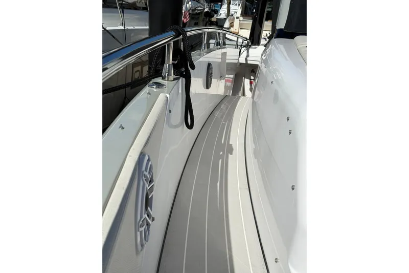 Chicken Money Yacht Photos Pics 2023 Azimut Verve 47 yacht deck with sleek design and polished railings.