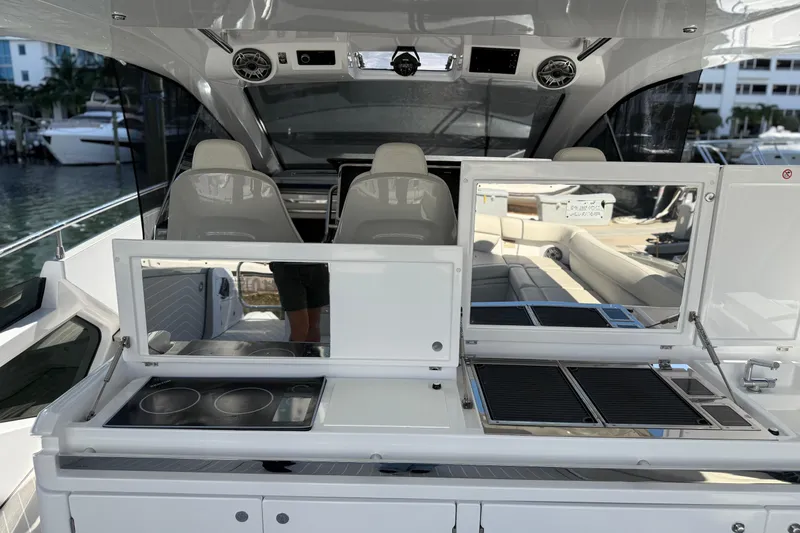 Chicken Money Yacht Photos Pics 2023 Azimut Verve 47 yacht interior with modern kitchen and seating area.