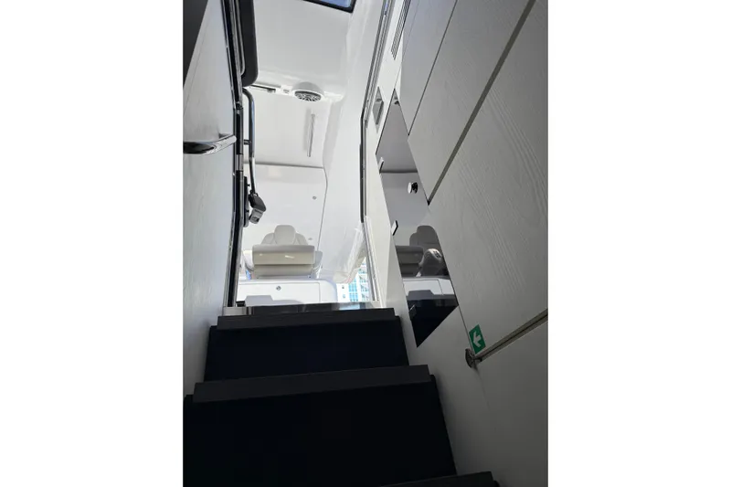 Chicken Money Yacht Photos Pics Interior stairs of 2023 Azimut Verve 47 yacht, showcasing modern design.