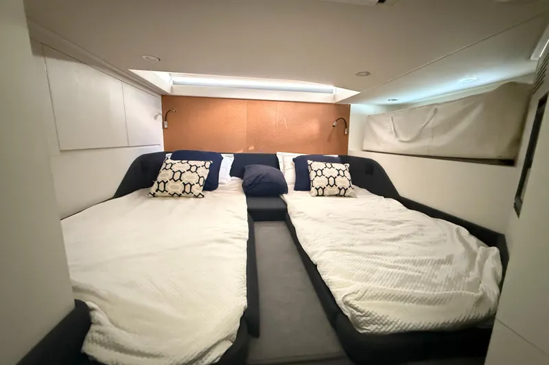 Chicken Money Yacht Photos Pics Interior cabin of 2023 Azimut Verve 47 yacht with twin beds and modern decor.