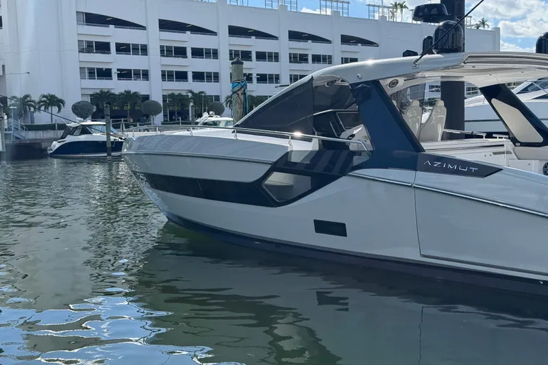 Chicken Money Yacht Photos Pics 2023 Azimut Verve 47 luxury yacht docked at marina, sleek design and modern features.