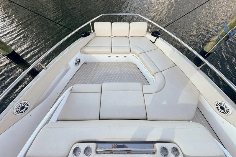 Chicken Money Yacht Photos Pics Luxurious seating area on 2023 Azimut Verve 47 yacht, featuring elegant white cushions.