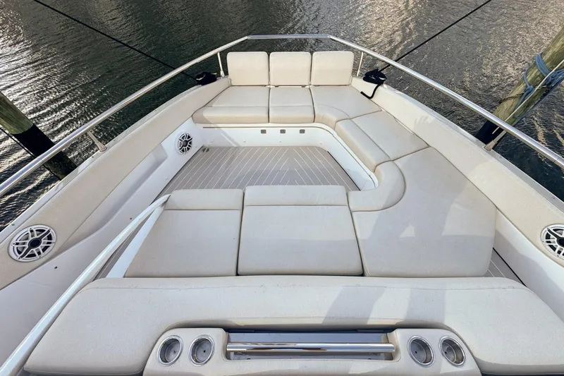 Chicken Money Yacht Photos Pics Luxurious seating area on 2023 Azimut Verve 47 yacht, featuring plush cushions and sleek design.