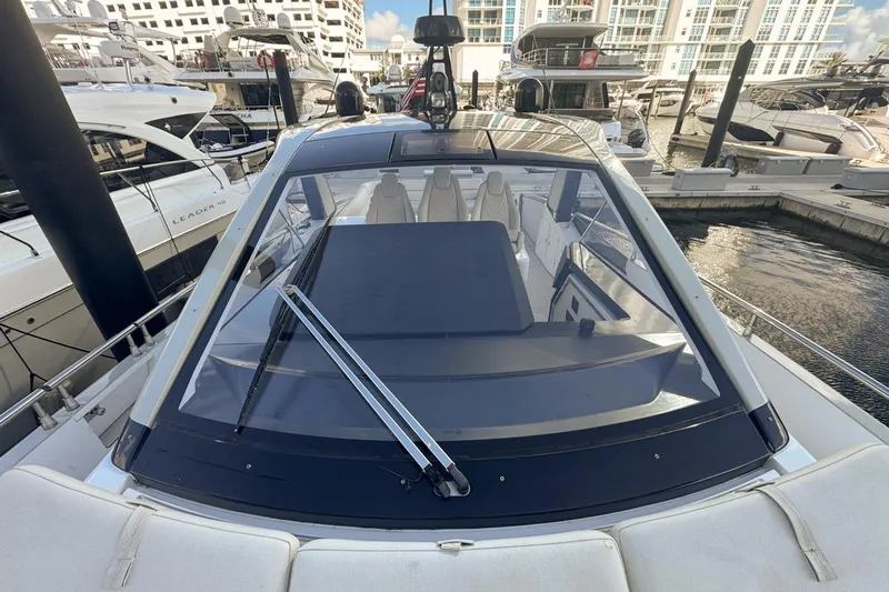 Chicken Money Yacht Photos Pics 2023 Azimut Verve 47 yacht docked at marina, showcasing sleek design and luxury features.