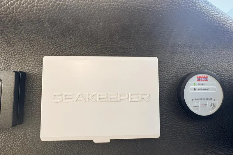 Chicken Money Yacht Photos Pics Seakeeper and Sea-Fire controls on 2023 Azimut Verve 47 yacht dashboard.