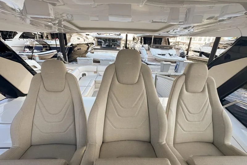 Chicken Money Yacht Photos Pics Luxury seating on 2023 Azimut Verve 47 yacht, showcasing elegant design and comfort.