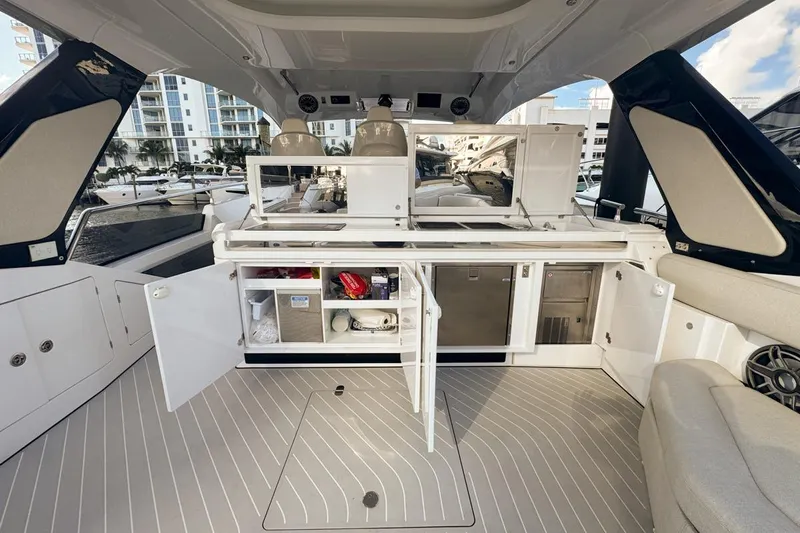 Chicken Money Yacht Photos Pics 2023 Azimut Verve 47 yacht interior with open storage and modern amenities.