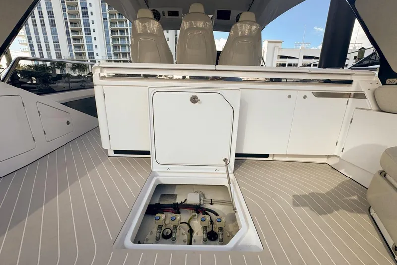 Chicken Money Yacht Photos Pics 2023 Azimut Verve 47 yacht interior with open hatch and sleek seating.
