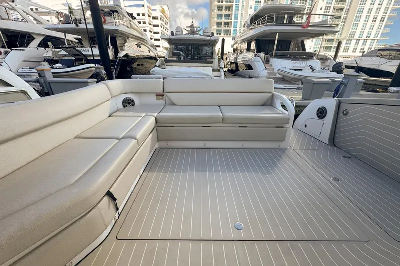 Chicken Money Yacht Photos Pics 2023 Azimut Verve 47 yacht interior with spacious seating and modern design at a marina.