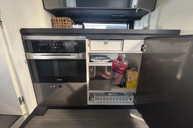 Chicken Money Yacht Photos Pics Modern kitchen area in 2023 Azimut Verve 47 yacht with Miele appliances.