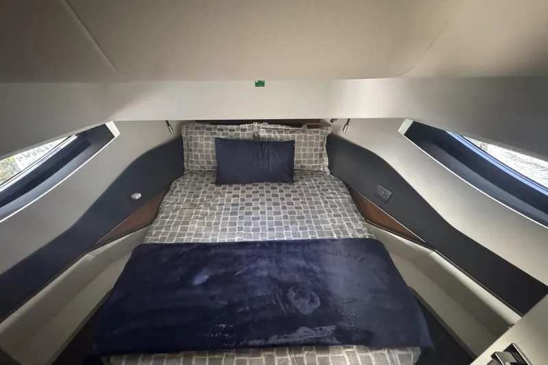 Chicken Money Yacht Photos Pics Luxurious cabin interior of 2023 Azimut Verve 47 yacht with modern bedding.