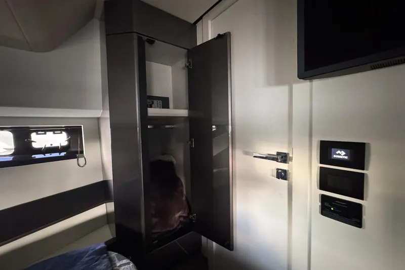 Chicken Money Yacht Photos Pics Interior of 2023 Azimut Verve 47 yacht, featuring sleek cabinetry and modern controls.