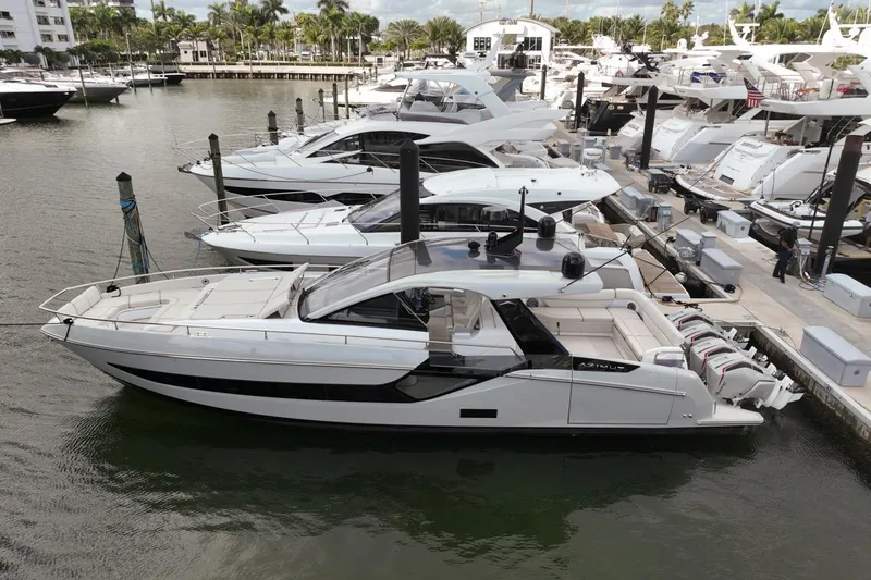 Chicken Money Yacht Photos Pics 2023 Azimut Verve 47 luxury yacht docked at marina, sleek design, modern features.