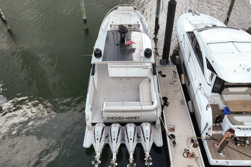 Chicken Money Yacht Photos Pics 2023 Azimut Verve 47 luxury yacht docked, aerial view, with four powerful engines.