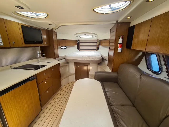  Yacht Photos Pics Luxurious interior of 2015 Cruisers Yachts 350 Express with modern amenities and cozy seating.