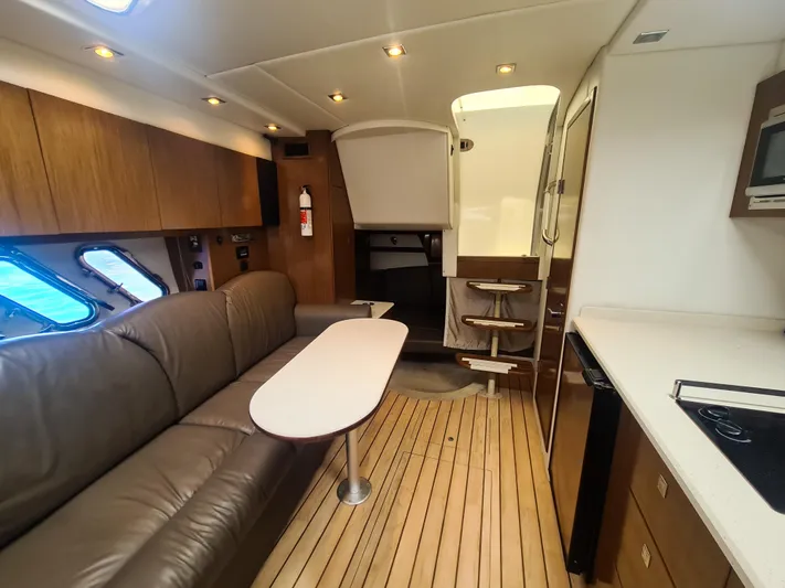  Yacht Photos Pics 2015 Cruisers Yachts 350 Express interior with leather seating and modern kitchen.